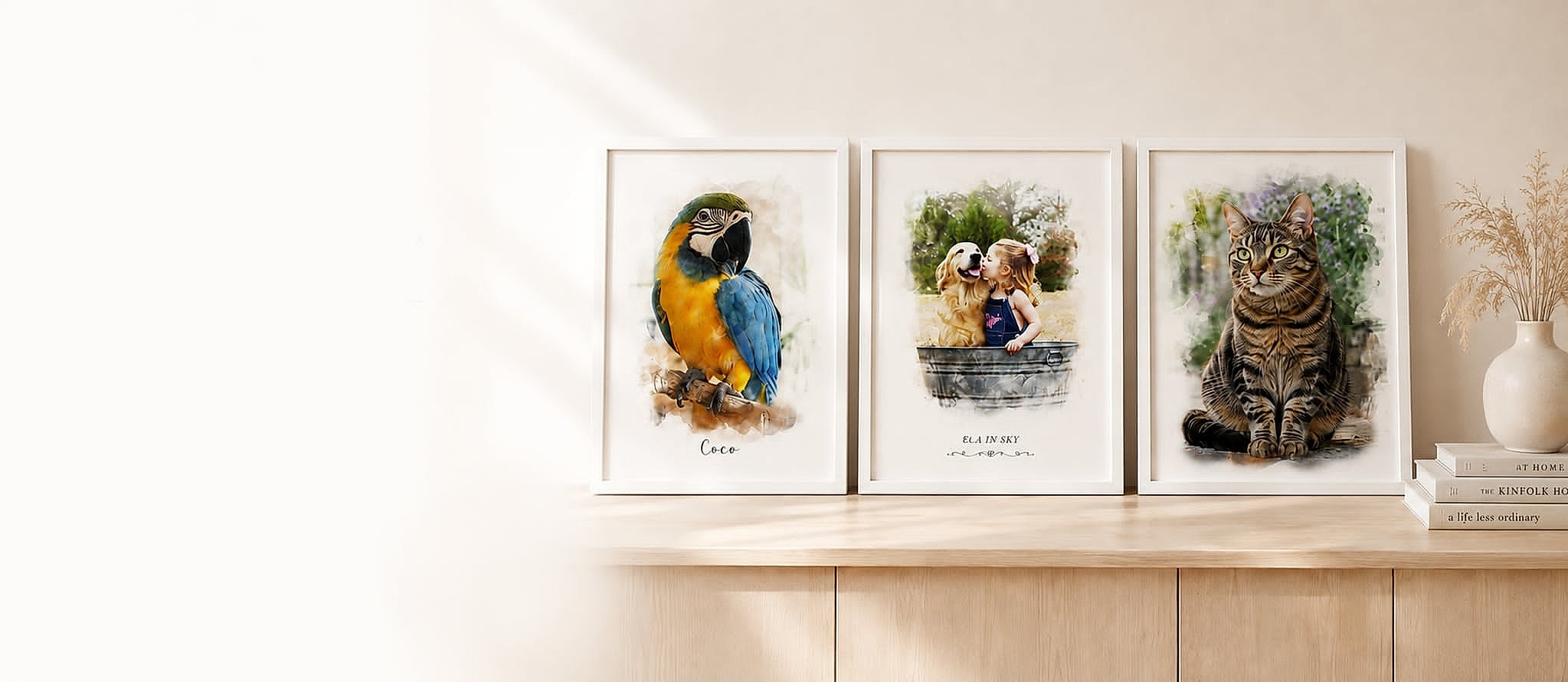 Three framed watercolour portraits on a wooden sideboard